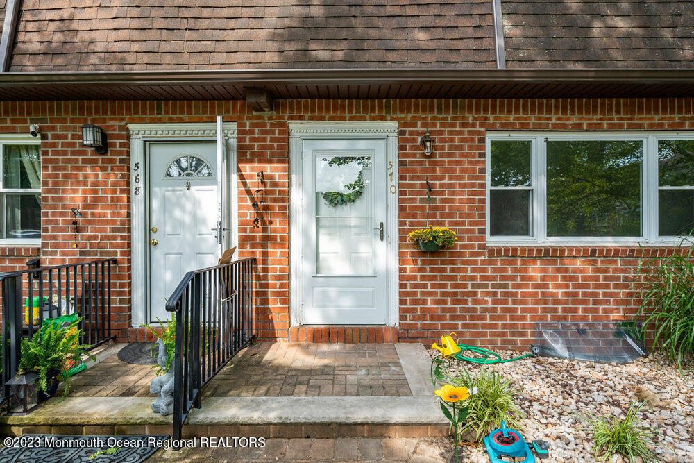 570 Labanna Court Brick, NJ 08724 - Photo 3 of 28 a front view of a house with a garden