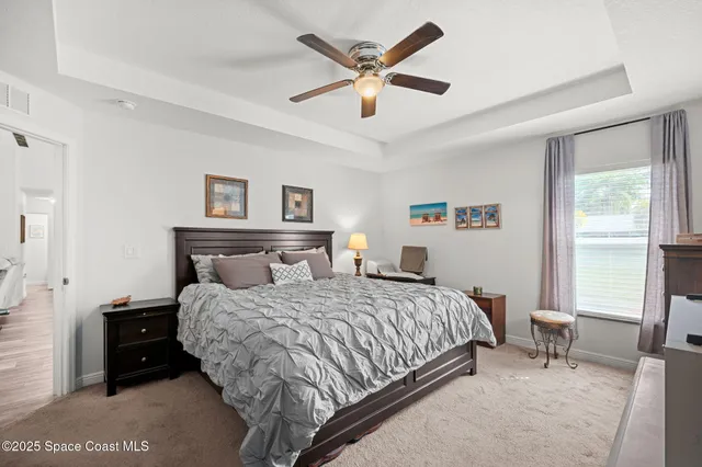 a bathroom with a granite countertop double vanity sinks and a mirror