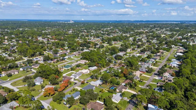 an aerial view of a house with a garden