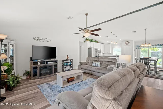 a kitchen with stainless steel appliances white cabinets and a sink