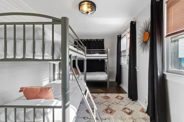 a large bed sitting in a bedroom next to a cabinet