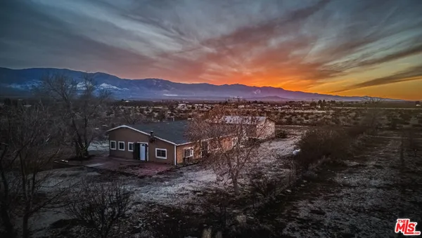 a view of house with mountain view