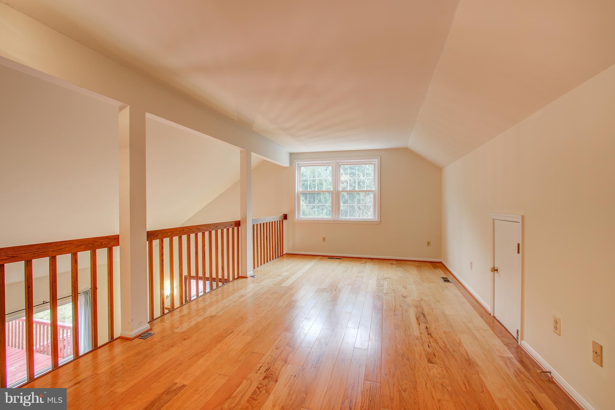 700 Bryants Nursery Road Silver Spring, MD 20905 - Photo 29 of 41 a view of a big room with wooden floor and windows