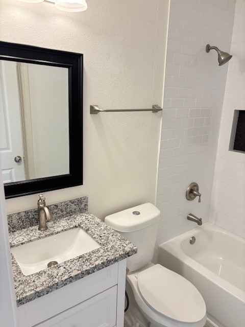 5217 Malmedy Road, Unit A Houston, TX 77033 - Photo 15 of 22 a bathroom with a granite countertop sink toilet and shower