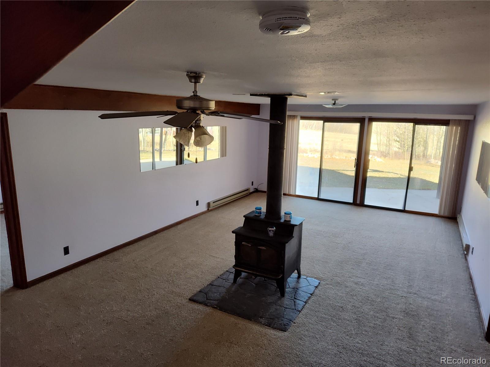2584 High Creek Road Fairplay, CO 80440 - Photo 15 of 26 a living room with furniture and a floor to ceiling window