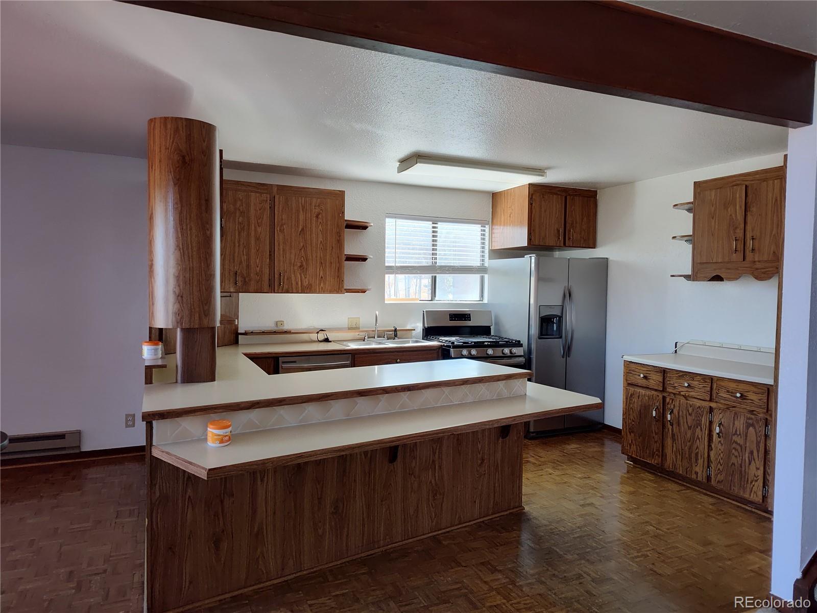 2584 High Creek Road Fairplay, CO 80440 - Photo 6 of 26 a kitchen with stainless steel appliances granite countertop a sink stove and refrigerator