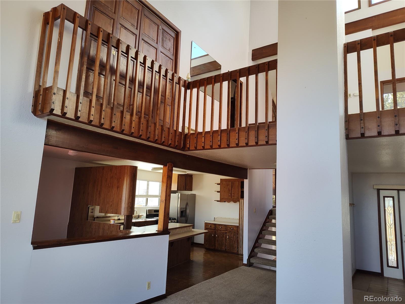 2584 High Creek Road Fairplay, CO 80440 - Photo 9 of 26 a view of a porch with wooden floor and stairs