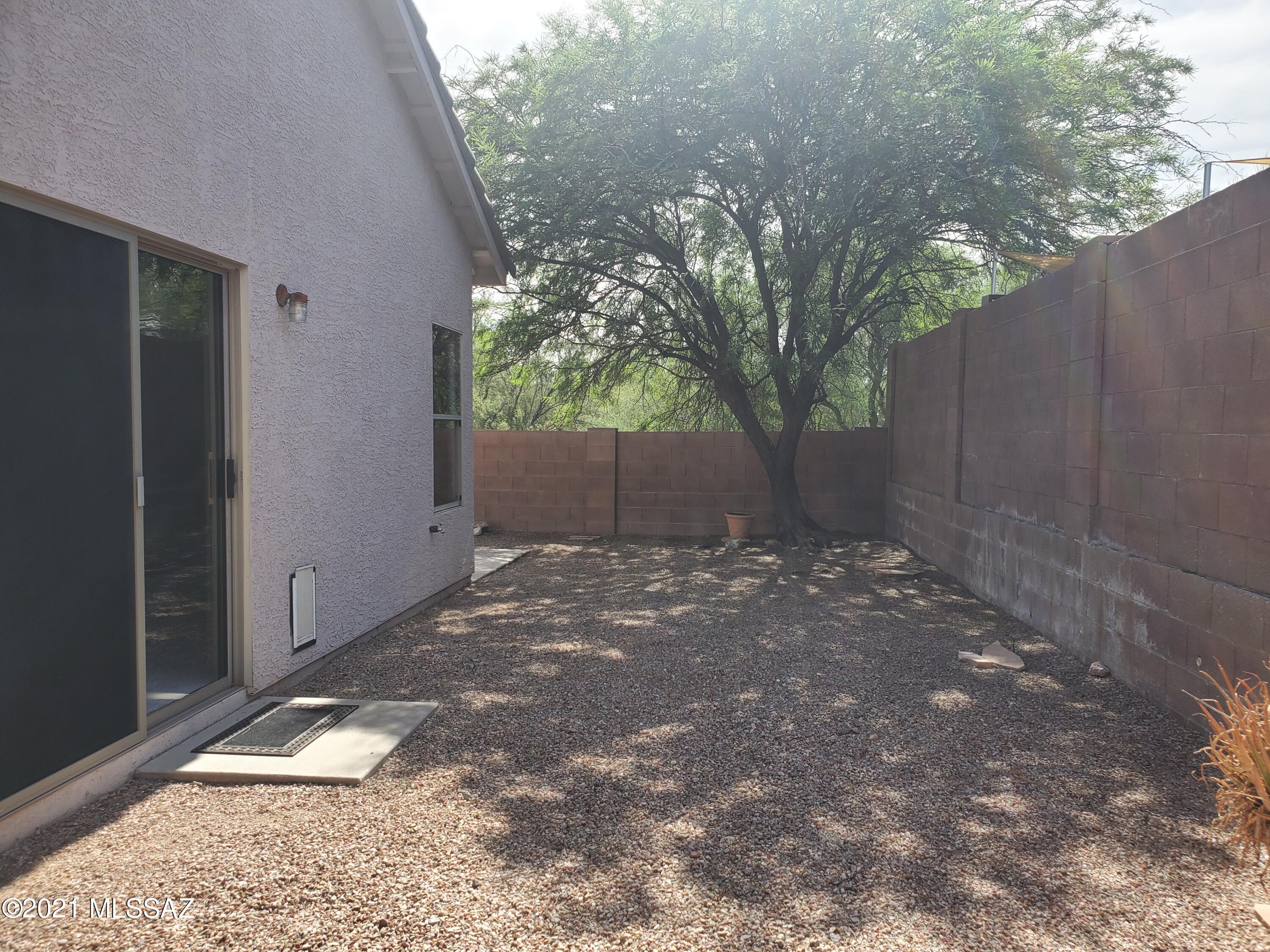 3455 North Boyce Spring Lane Tucson, AZ 85745 - Photo 19 of 21 a view of a house with a backyard of a house