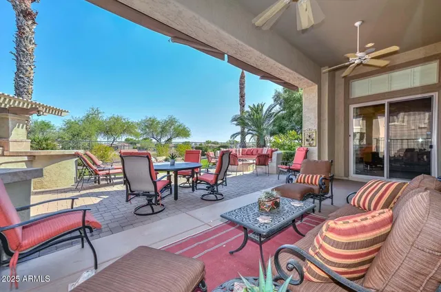 a view of an ocean and trees in the background