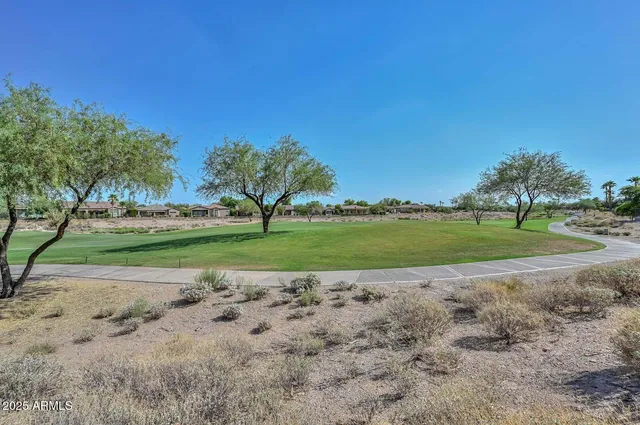 a view of a lake with houses in front of it