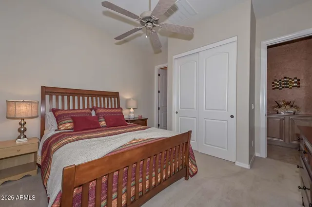 a bedroom with a bed and a dresser