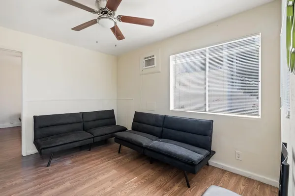 a living room with furniture and a window