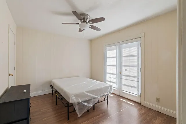 a view of a livingroom with furniture and wooden floor