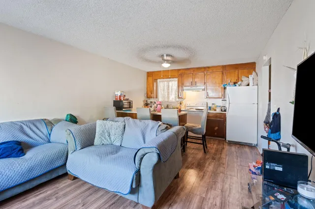 a living room with furniture fireplace and a flat screen tv