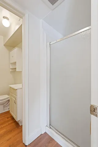 a view of bathroom with a toilet sink and a mirror