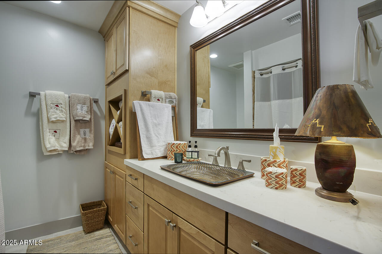 3337 East Las Rocas Drive Phoenix, AZ 85028 - Photo 19 of 22 a bathroom with a sink and a mirror