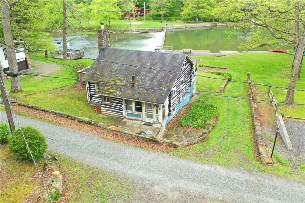 147 Laurel Drive Markleton, PA 15551 - Photo 20 of 23 a view of a house with a yard and a large tree