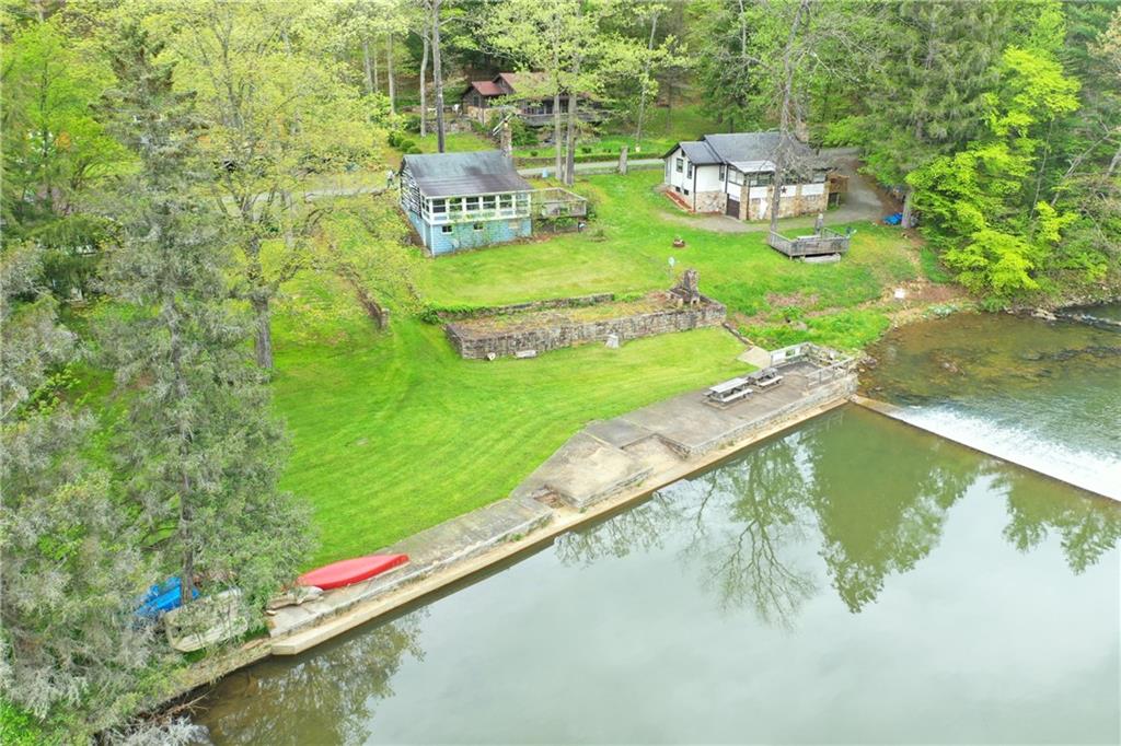 147 Laurel Drive Markleton, PA 15551 - Photo 21 of 23 a view of a lake with a yard and large trees