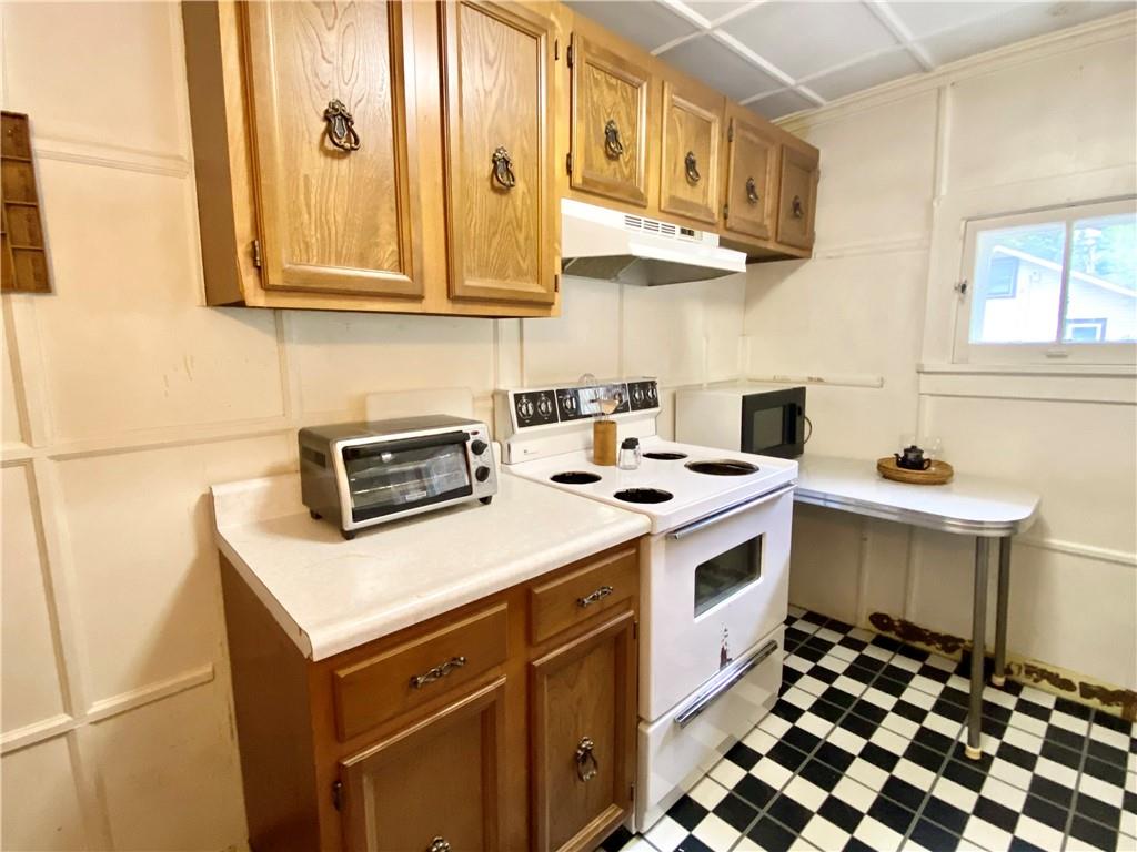 147 Laurel Drive Markleton, PA 15551 - Photo 4 of 23 a kitchen with stainless steel appliances granite countertop a sink and a stove