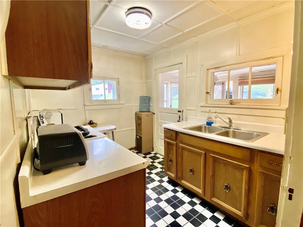 147 Laurel Drive Markleton, PA 15551 - Photo 6 of 23 a kitchen with stainless steel appliances a stove a sink a microwave and a refrigerator