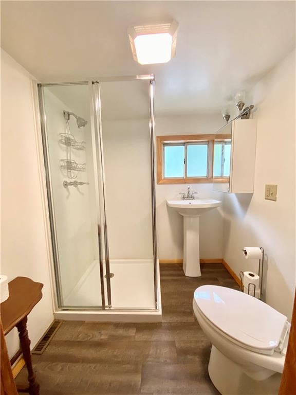 147 Laurel Drive Markleton, PA 15551 - Photo 9 of 23 a bathroom with a toilet a sink and a mirror