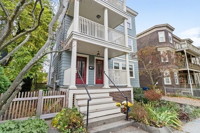 front view of a house with a small yard