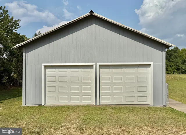 a view of empty room with wooden ceiling