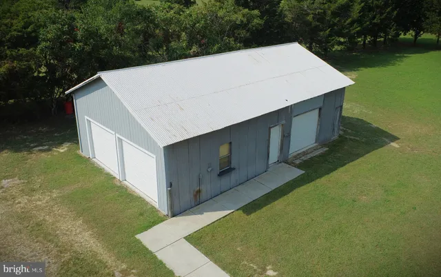 a large kitchen with stainless steel appliances granite countertop a stove a sink dishwasher and a refrigerator