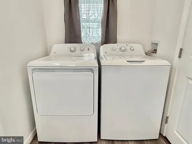 a bathroom with a sink vanity granite and toilet