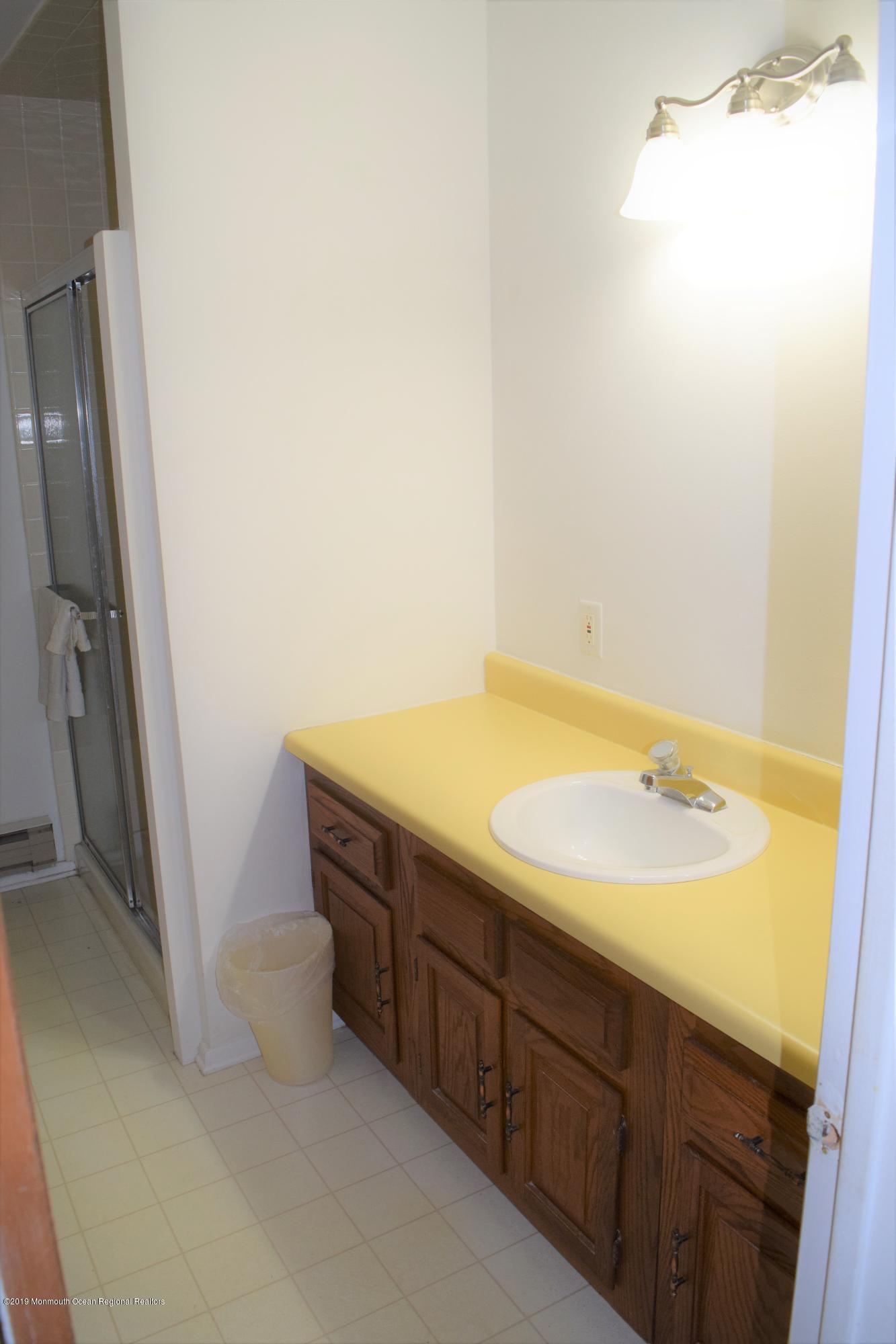 9 B Sunset Road Whiting, NJ 08759 - Photo 26 of 54 a bathroom with a sink and a tub