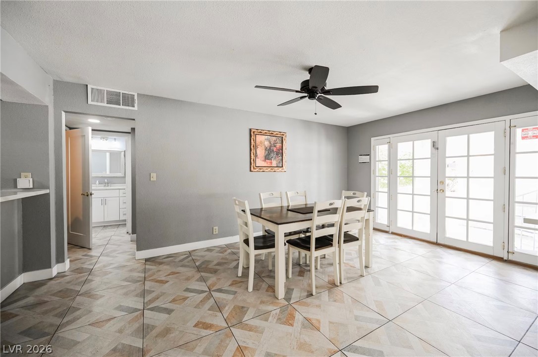 1803 Nuevo Road Henderson, NV 89014 - Photo 20 of 71 Dining space featuring ceiling fan and baseboards