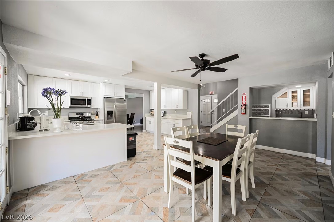 1803 Nuevo Road Henderson, NV 89014 - Photo 21 of 71 Dining area with ceiling fan and recessed lighting