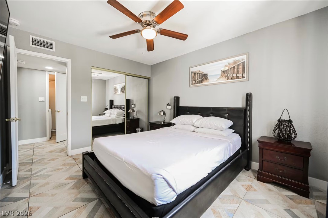 1803 Nuevo Road Henderson, NV 89014 - Photo 26 of 71 Bedroom with a ceiling fan and a closet