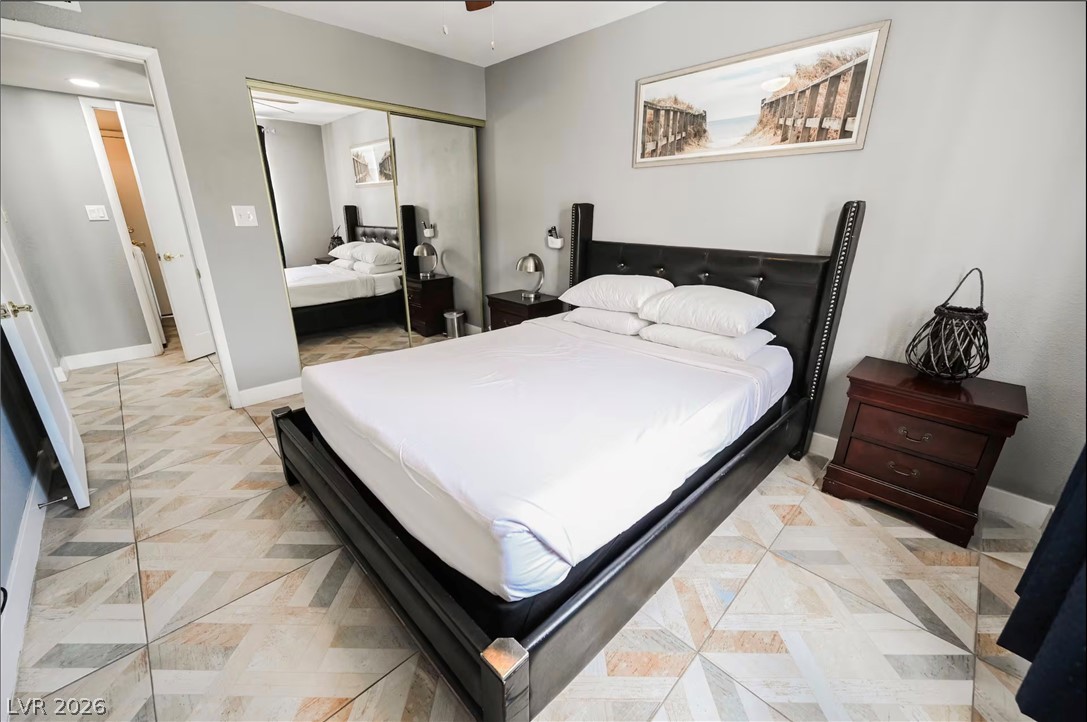 1803 Nuevo Road Henderson, NV 89014 - Photo 27 of 71 Bedroom with ceiling fan and a closet