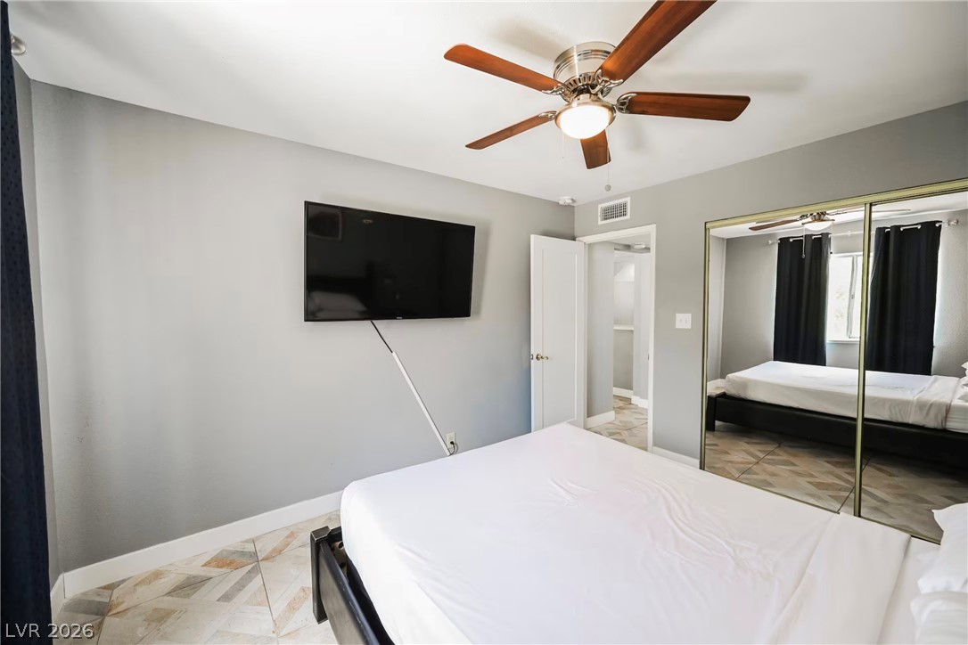 1803 Nuevo Road Henderson, NV 89014 - Photo 28 of 71 Bedroom with a ceiling fan and a closet