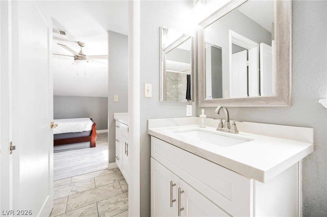 1803 Nuevo Road Henderson, NV 89014 - Photo 38 of 71 Ensuite bathroom with vanity and a ceiling fan
