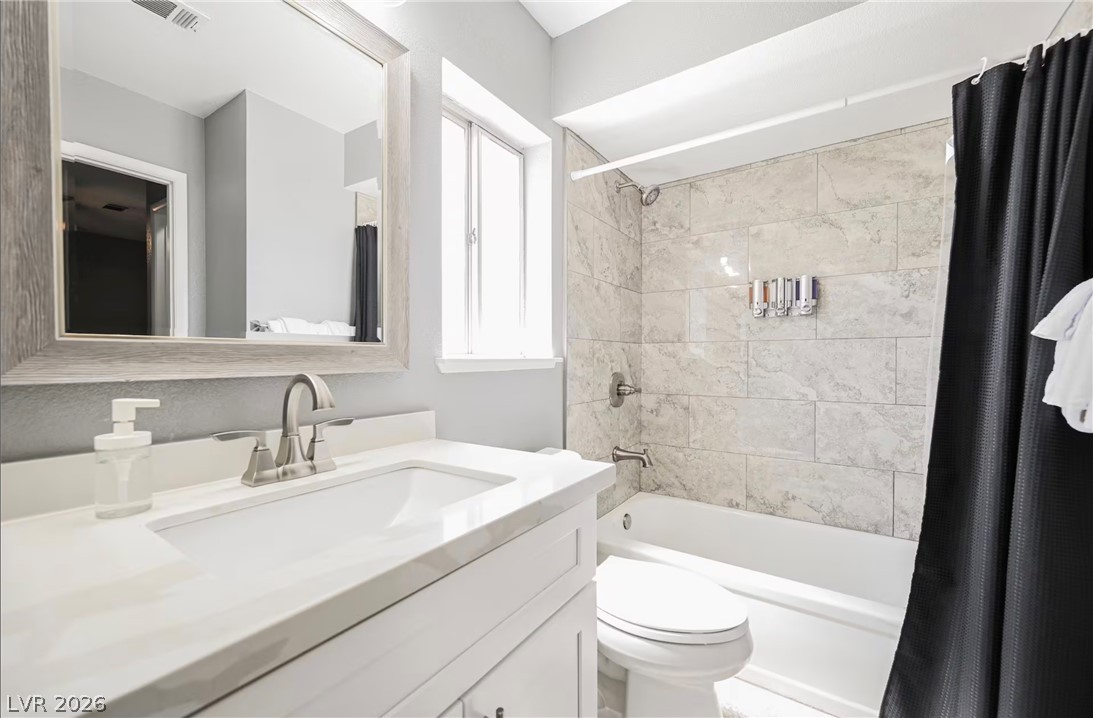 1803 Nuevo Road Henderson, NV 89014 - Photo 39 of 71 Full bathroom with vanity and shower / bathtub combination with curtain