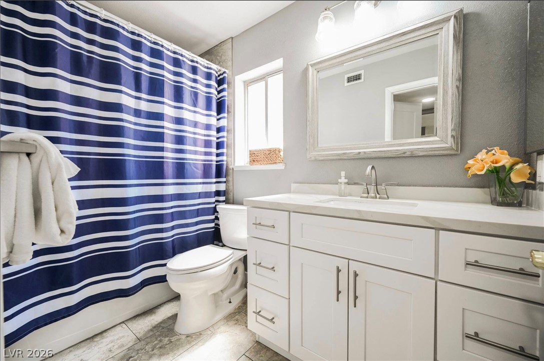 1803 Nuevo Road Henderson, NV 89014 - Photo 41 of 71 Full bath with curtained shower and vanity
