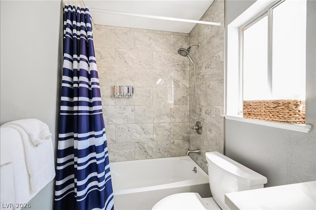 1803 Nuevo Road Henderson, NV 89014 - Photo 43 of 71 Bathroom with shower / bath combination with curtain and vanity