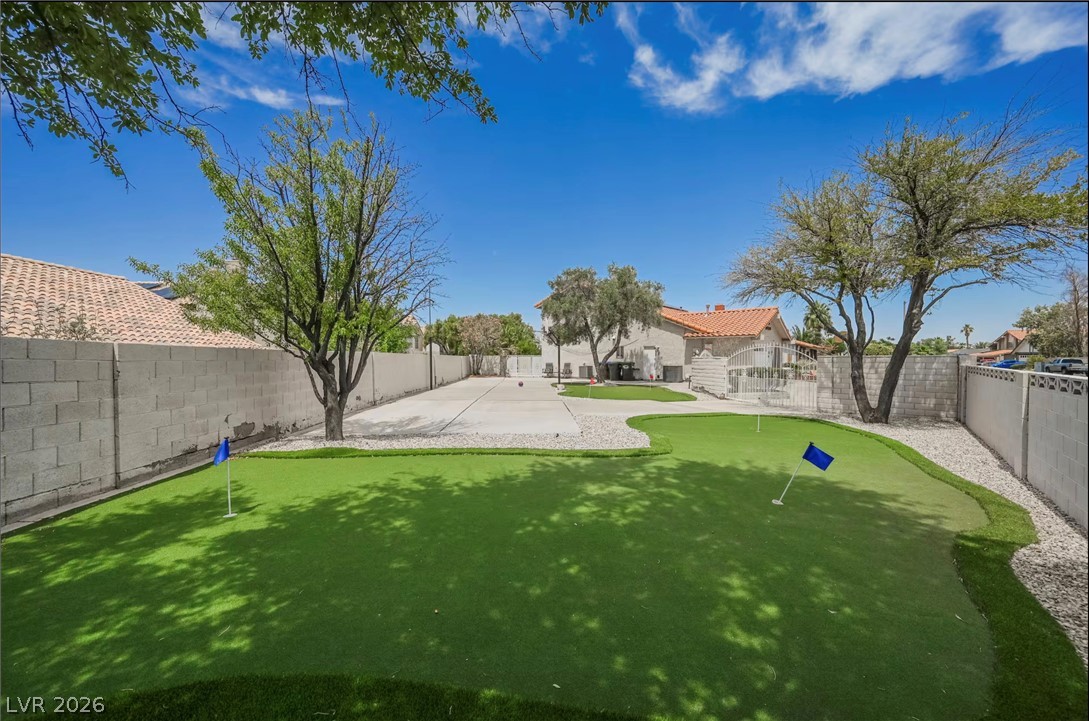 1803 Nuevo Road Henderson, NV 89014 - Photo 44 of 71 Fenced backyard with a putting area