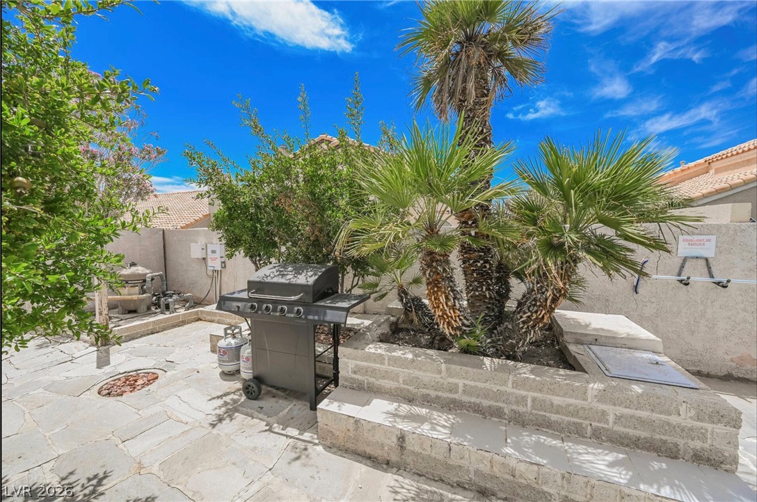 1803 Nuevo Road Henderson, NV 89014 - Photo 48 of 71 Fenced backyard featuring a grill and a patio area