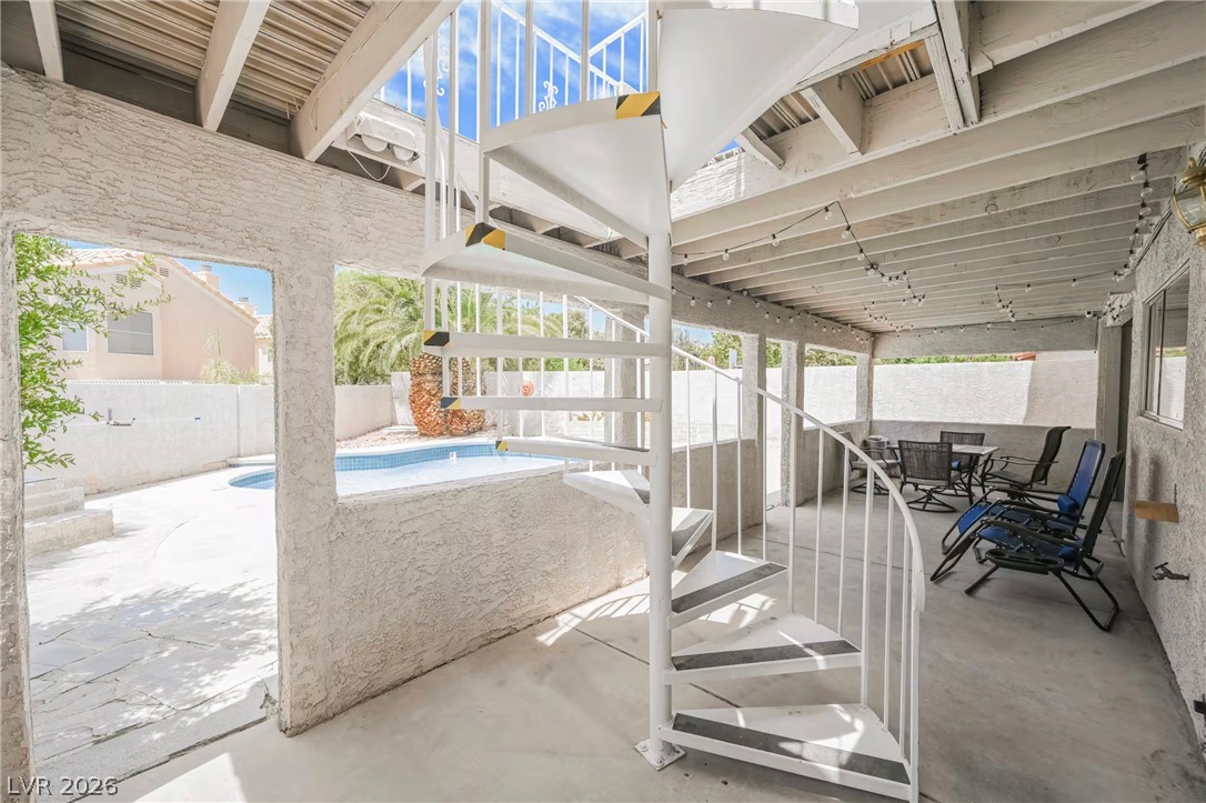 1803 Nuevo Road Henderson, NV 89014 - Photo 51 of 71 Fenced backyard with a patio area and outdoor dining area