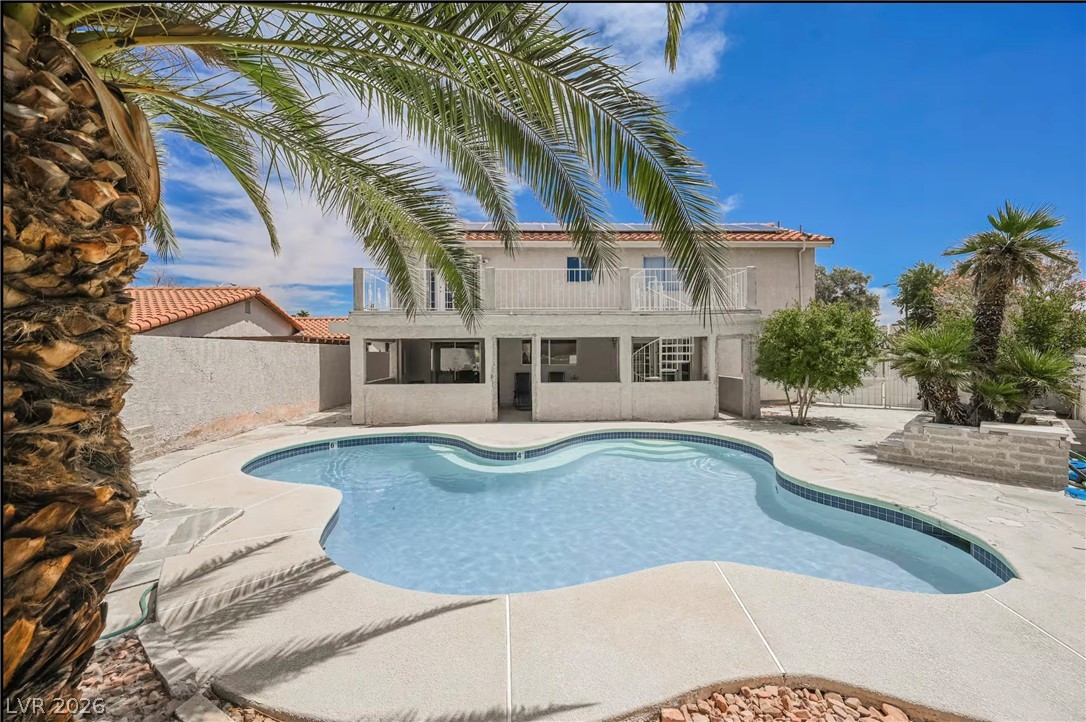 1803 Nuevo Road Henderson, NV 89014 - Photo 61 of 71 View of pool with patio surround, a fenced backyard, and a balcony