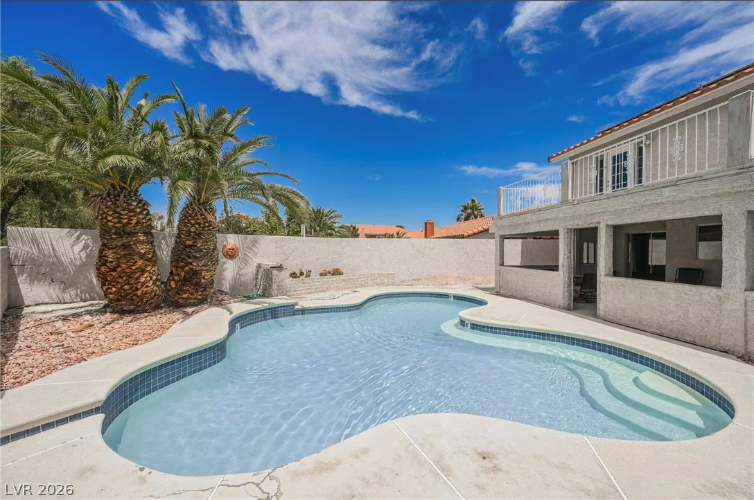 1803 Nuevo Road Henderson, NV 89014 - Photo 62 of 71 View of pool featuring a fenced backyard and patio surround