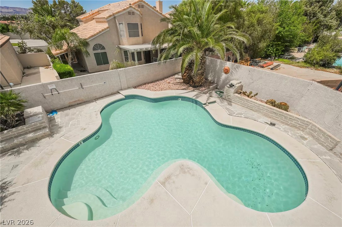 1803 Nuevo Road Henderson, NV 89014 - Photo 65 of 71 View of pool with a fenced backyard and patio surround