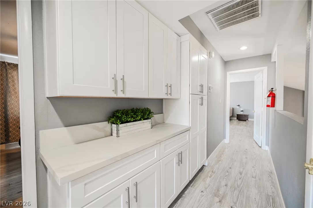1803 Nuevo Road Henderson, NV 89014 - Photo 71 of 71 Hallway with light wood-style flooring and recessed lighting