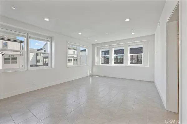 a large kitchen with stainless steel appliances granite countertop a stove and a refrigerator