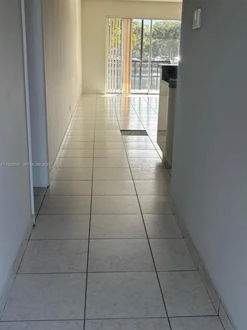 a view of hallway with windows