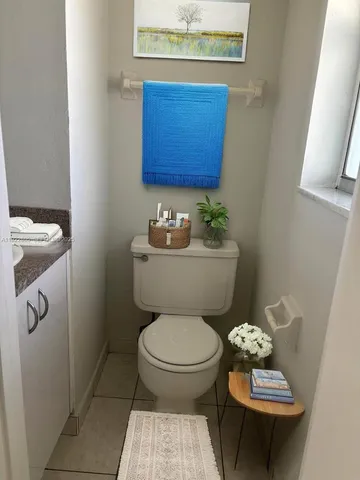 a bathroom with a toilet a sink and bathtub