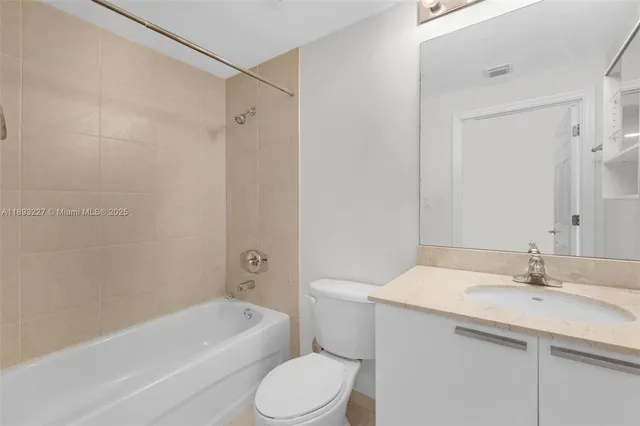 a bathroom with a sink toilet and bathtub